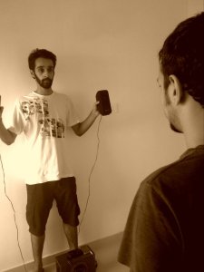 Akshay holding the speakers and Kuber finding the sweet spot in the "studio".